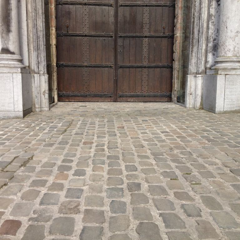 Application image for Sandstone - Reclaimed European Cobblestones. The image shows this material being used in a patio pavers application. The surface finish shown is sawn. Dominant colors shown are brown and gray. The color mix creates a warm feeling.
