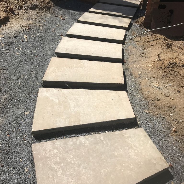Application image for Sandstone - Reclaimed Sidewalk Stones. The image shows this material being used in a path pavers application.