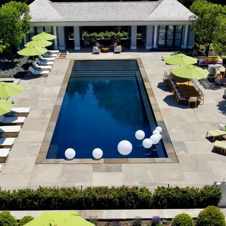 Application image for Sandstone - Reclaimed Sidewalk Stones. The image shows this material being used for pool coping, patio pavers and pool deck pavers.
