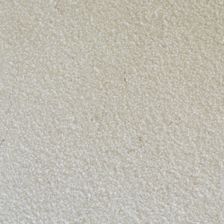 Color/Finish variation image for Mountain Hard Limestone - Beige. The surface finishes shown are brushed and fine bush hammered. Dominant colors shown are beige, gray and white; with a tan secondary. The color mix creates a warm feeling. Speckled color pattern.