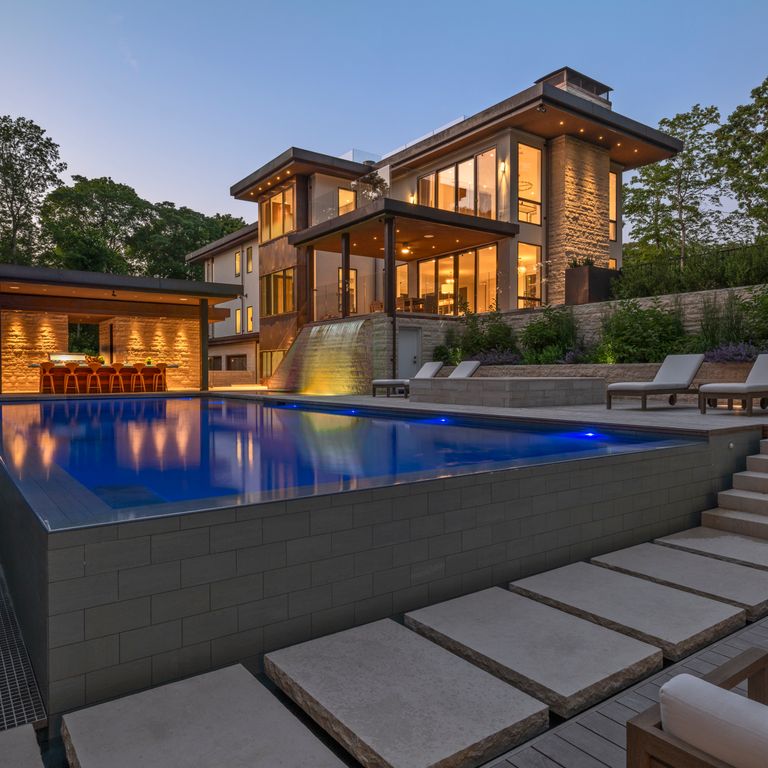 Feature image for Limestone - Mountain Hard Beige. The image shows this material being used for patio pavers, monolithic steps, full bed veneer and pool deck pavers. Dominant colors shown are beige, tan and cream.