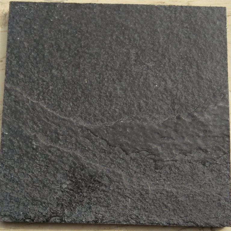 Color/Finish variation image for Limestone - Bahama Black. The surface finish shown is brushed. Dominant colors shown are black and gray. Exhibits 