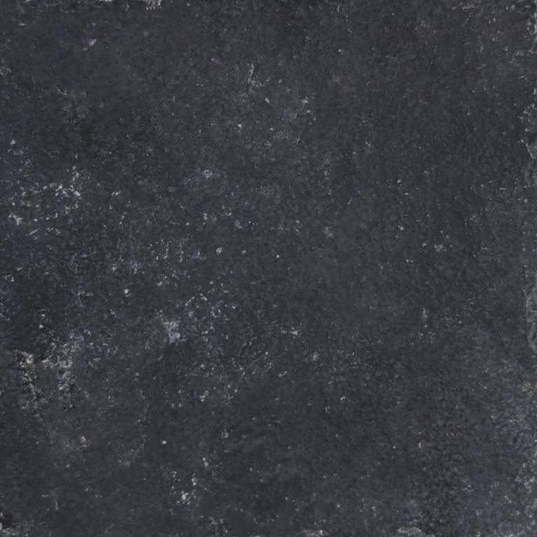 Swatch image for Limestone - Bahama Black. The surface finish shown is a combination of brushed and split-face with flat plane. The dominant color shown is black; with brown and gray secondaries. The color mix creates a cool feeling. Regular color pattern. Contains mineral inclusions.