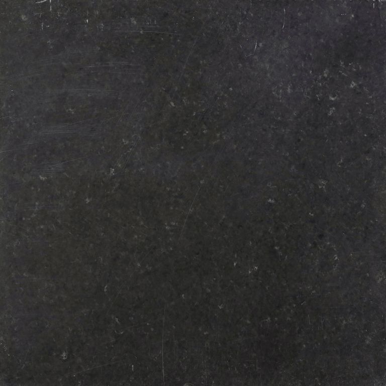 Feature image for Bahama Black Limestone. The dominant color shown is black; with brown and gray secondaries. The color mix creates a cool feeling. Solid color pattern.