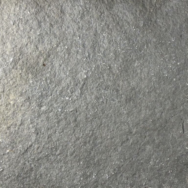 Color/Finish variation image for Mississippi Grey Limestone. The surface finishes shown are brushed and split-face with flat plane. The dominant color shown is gray; with beige and green secondaries. The color mix creates a cool feeling. Regular, fine speckled and cloudy color patterns.