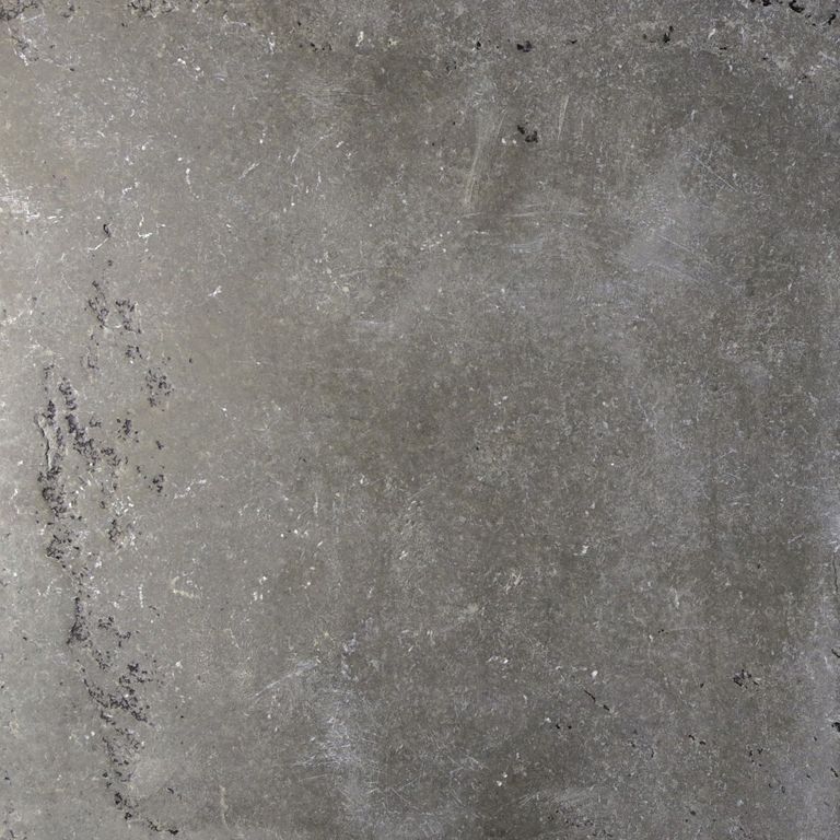 Feature image for Mississippi Grey Limestone. The dominant color shown is gray; with brown, green and purple secondaries. The color mix creates a cool feeling. Blotched and cloudy color patterns.