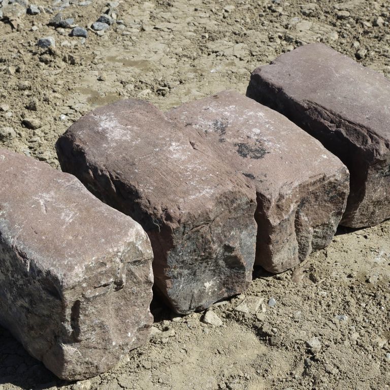 Application image for Sandstone - Reclaimed Midwest Cobblestones. The surface finish shown is . Dominant colors shown are brown, gray and orange/rust; with beige, purple and tan secondaries. The color mix creates a warm feeling. Solid color pattern.