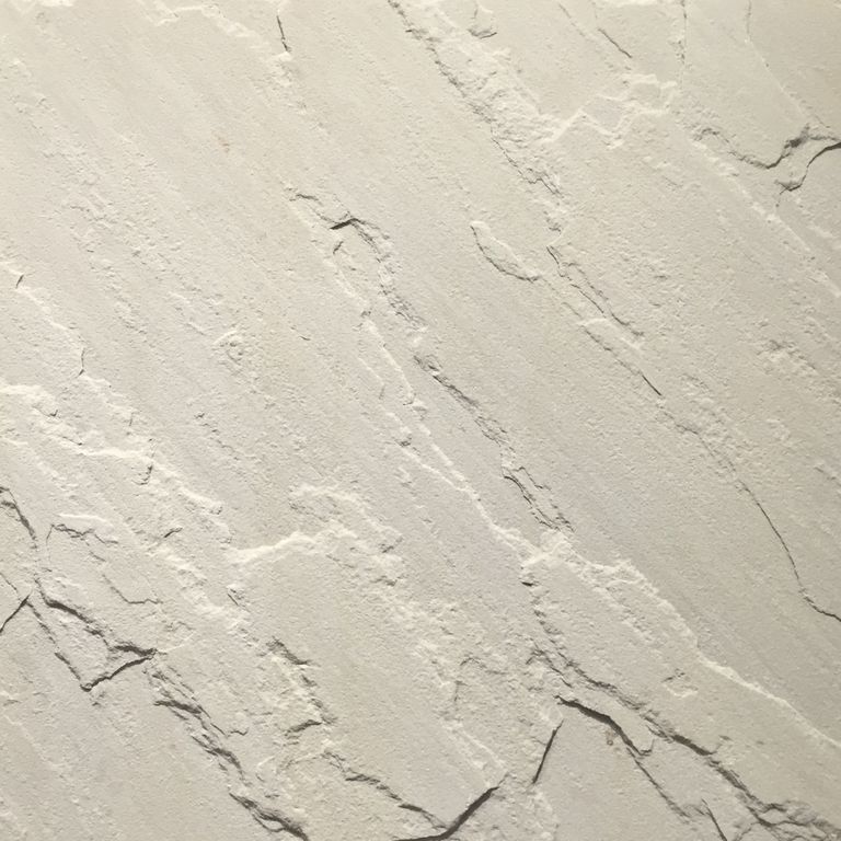 Swatch image for Sandstone - Portland White. Dominant colors shown are white and cream; with gray and white secondaries. Exhibits 