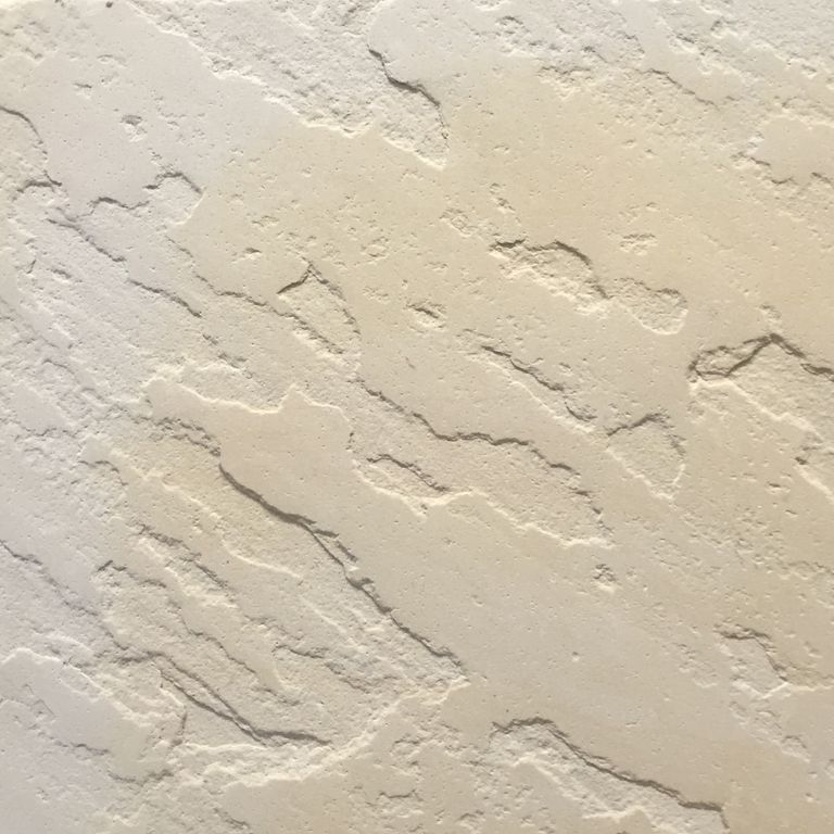 Color/Finish variation image for Portland Beige Sandstone. The surface finish shown is antiqued. The dominant color shown is beige; with gray, pink, white, tan and cream secondaries. Exhibits 