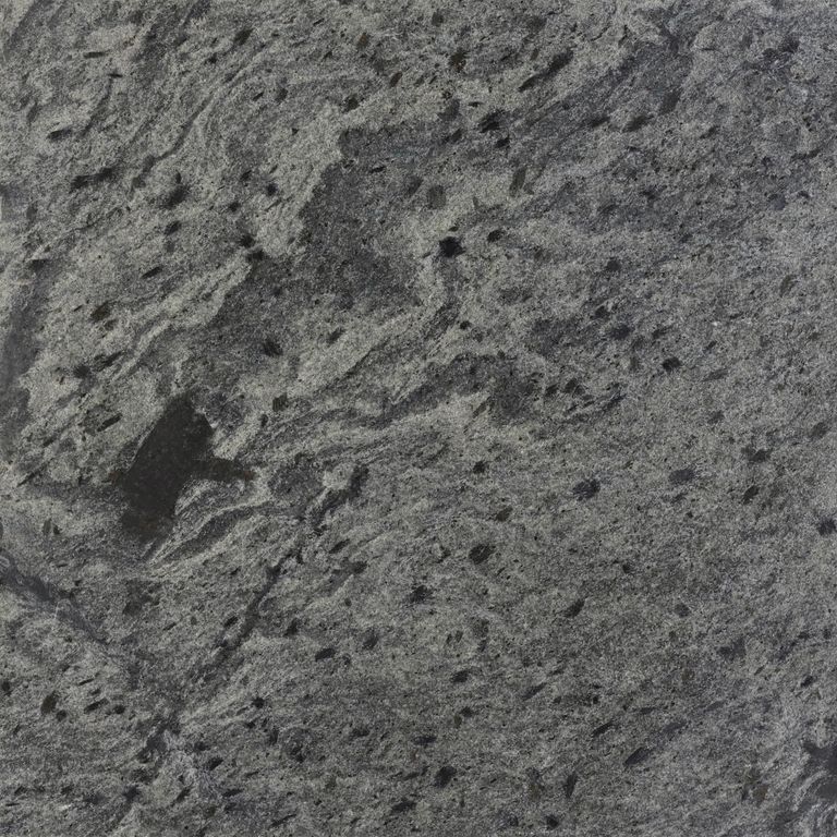 Swatch image cropped for Amazon Quartzite. The surface finish shown is honed. Dominant colors shown are green and gray; with black, brown and purple secondaries. Exhibits 