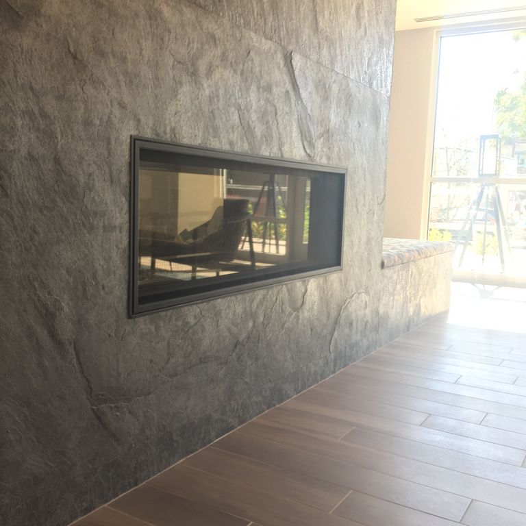 The image shows this material being used for fireplace surround and full bed veneer.