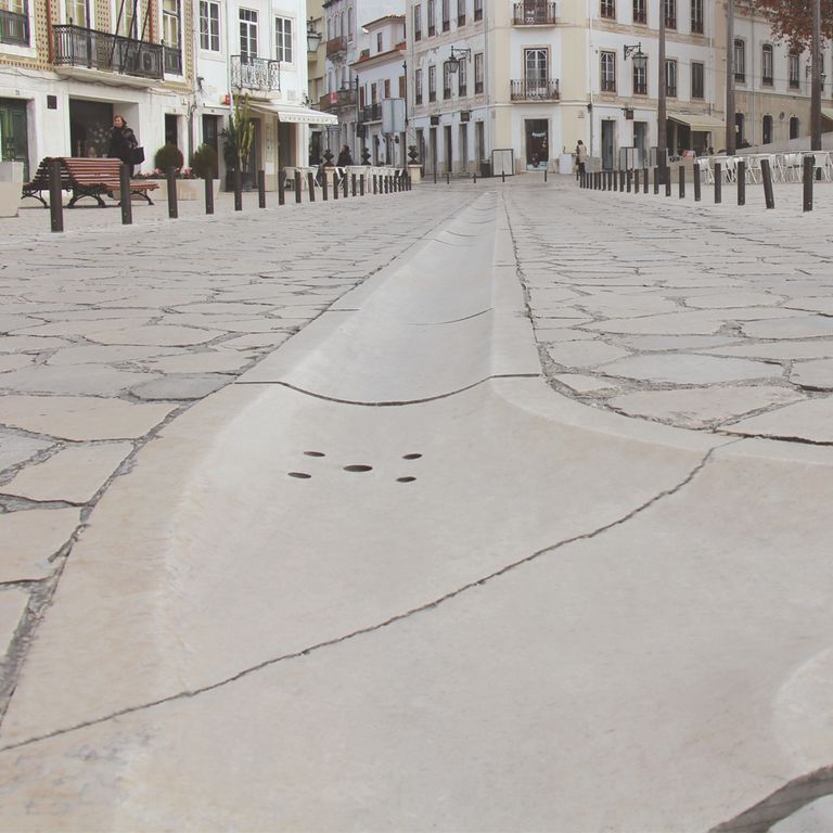 The image shows this material being used in a patio pavers application.
