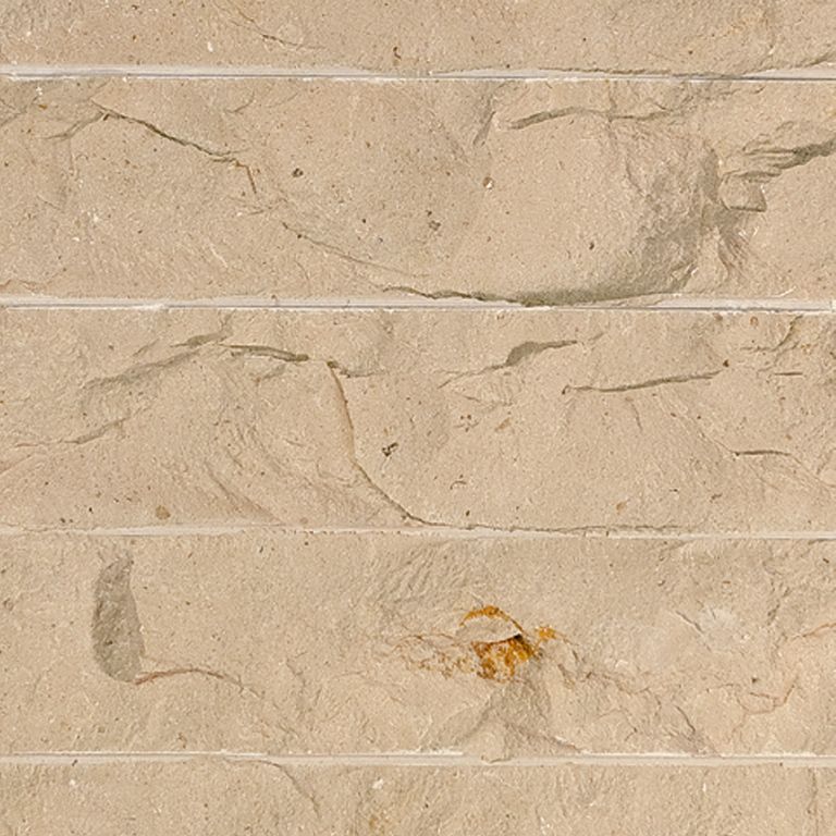 Color/Finish variation image for Cream Limestone. The surface finish shown is chiseled. Dominant colors shown are beige and tan; with brown, orange/rust and cream secondaries. Exhibits 