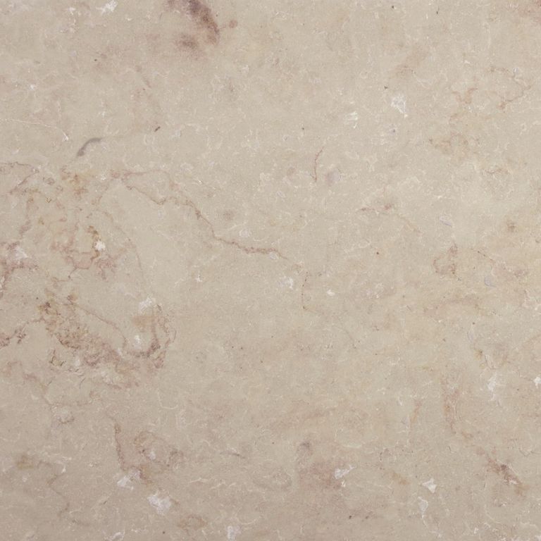 Close-up image for Cream Limestone. The surface finish shown is flamed. Dominant colors shown are beige and tan; with brown, orange/rust, pink and cream secondaries. Exhibits 
