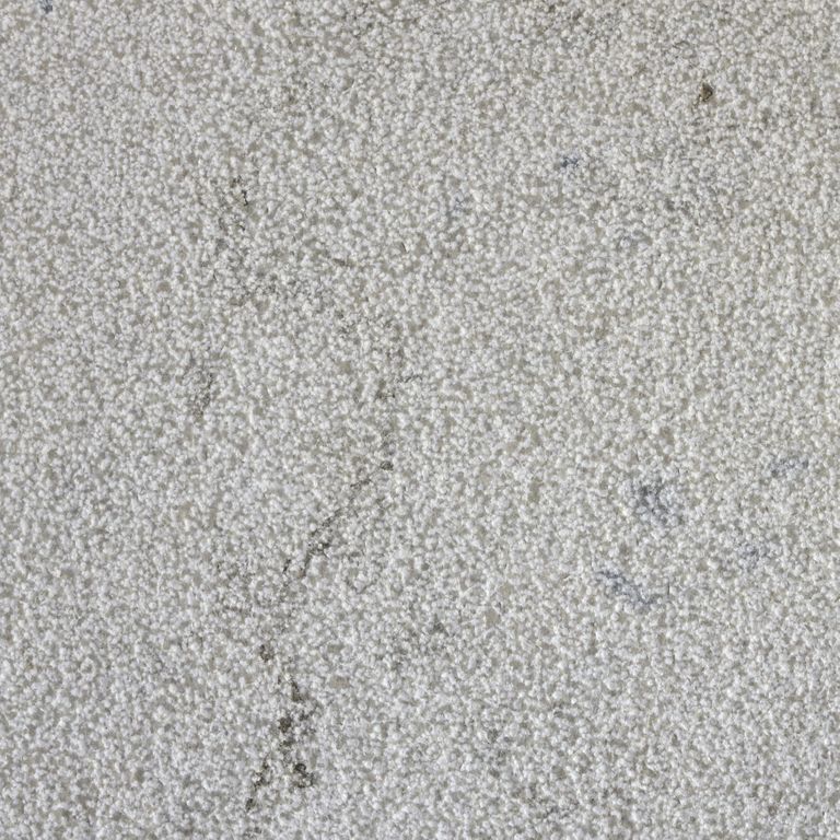 Color/Finish variation image for Sky Prima Limestone. The surface finish shown is bush hammered. The dominant color shown is gray; with beige and white secondaries. The color mix creates a cool feeling. Speckled and cloudy color patterns.