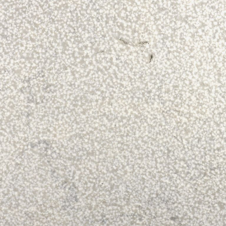 Color/Finish variation image for Sky Prima Limestone. The surface finishes shown are brushed and bush hammered. Dominant colors shown are beige, gray, white and cream. Coarse speckled and cloudy color patterns.