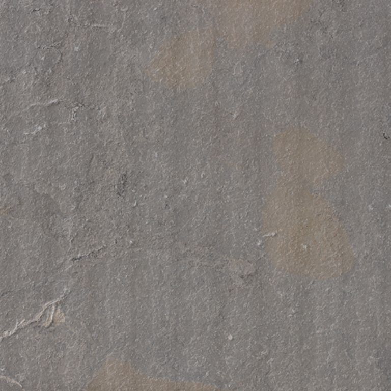 Color/Finish variation image for Limestone - Portuguese Amaza Estrema. The surface finish shown is flamed. The dominant color shown is gray; with brown, green and purple secondaries. The color mix creates a cool feeling. Random, blotched and cloudy color patterns. Contains mineral inclusions.