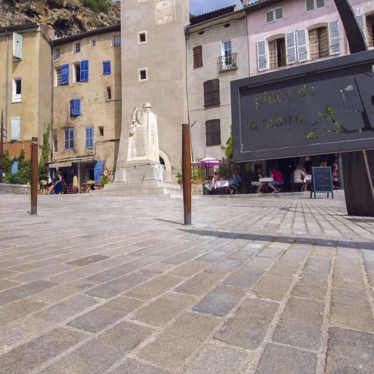 Feature image for Limestone - Portuguese Amaza Estrema. The image shows this material being used in a public area application. Dominant colors shown are beige, gray and tan; with brown and orange/rust secondaries. The color mix creates a warm feeling. Fine speckled color pattern.