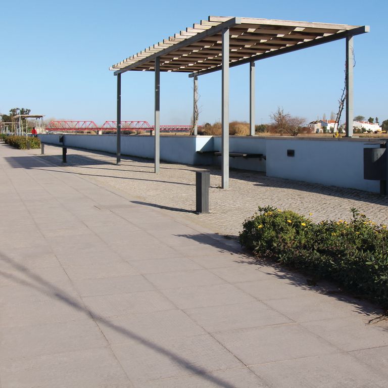 Feature image for Sky Estrema Limestone. The image shows this material being used in a path pavers application. The dominant color shown is gray; with beige and tan secondaries. The color mix creates a warm feeling. Solid color pattern.