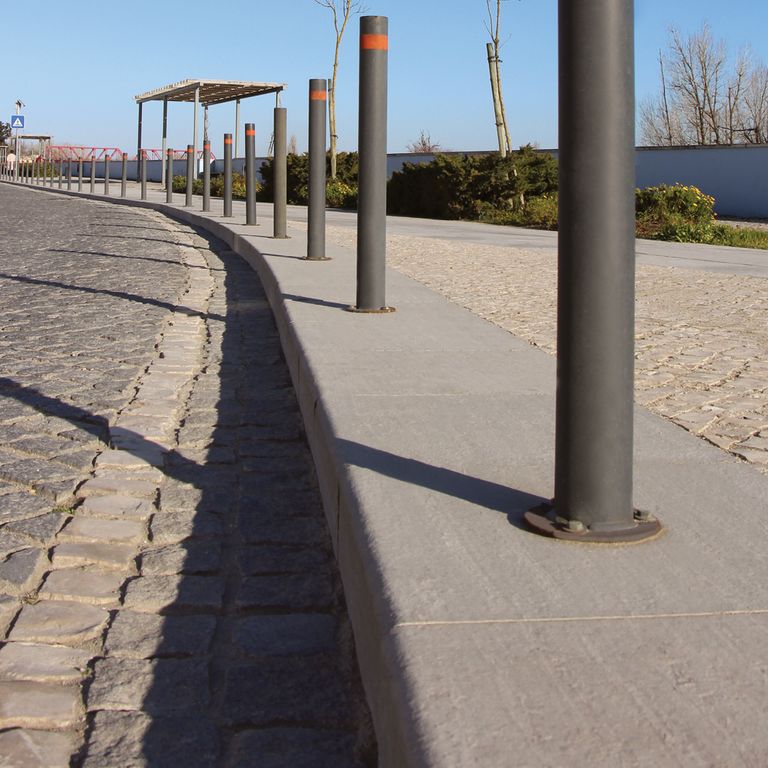 The image shows this material being used in a driveway pavers application.