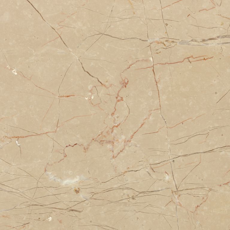 Close-up image for Limestone - Portuguese Alpine. The surface finish shown is honed. Dominant colors shown are beige, orange/rust and tan; with brown and cream secondaries. Exhibits 