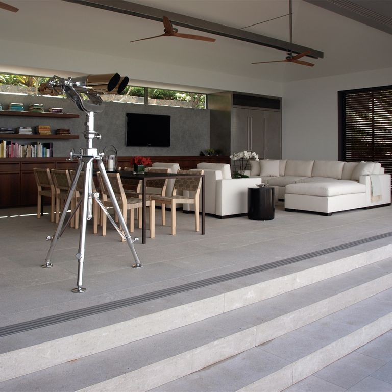 The image shows this material being used in an interior floor application.