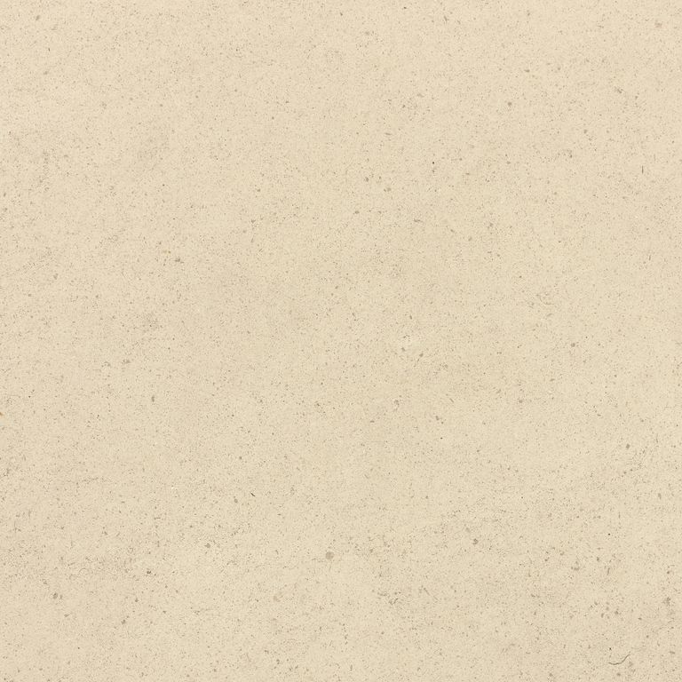 Close-up image for Royal White Limestone. The surface finish shown is honed. Dominant colors shown are beige and cream; with white and yellow secondaries. The color mix creates a warm feeling. Solid color pattern.