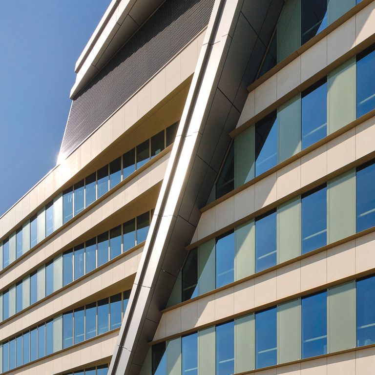 Application image for Limestone - Portuguese Royal White. The image shows this material being used for full bed veneer and window well.