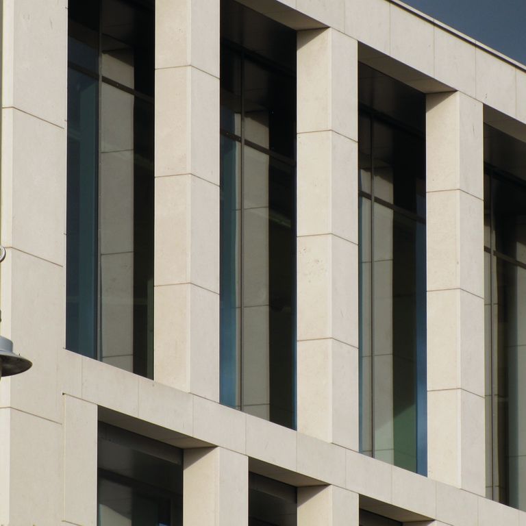 The image shows this material being used for architectural elements and full bed veneer.