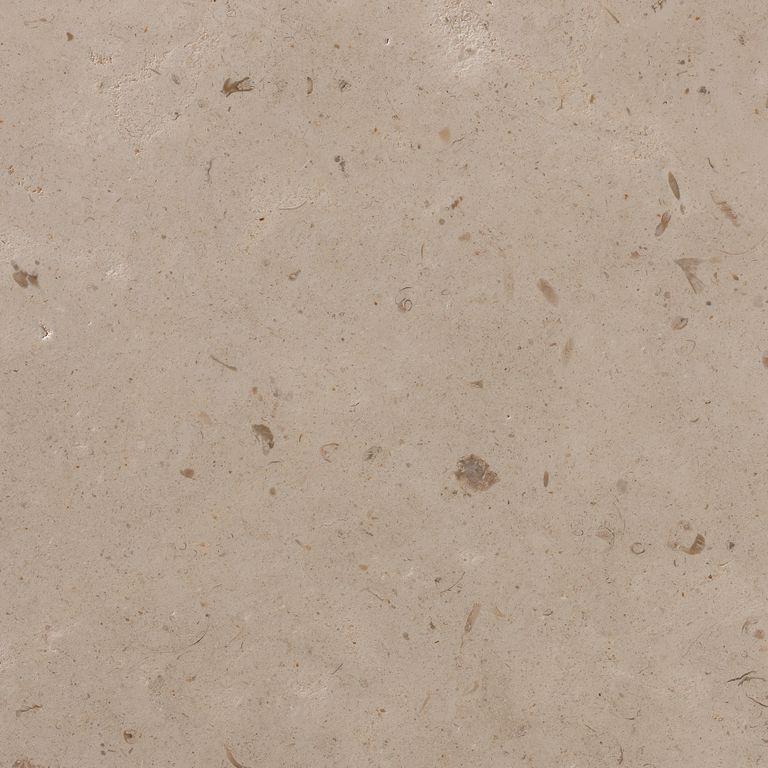 Close-up image for Cremcar Limestone. The surface finish shown is honed. Dominant colors shown are brown and tan; with beige, gray, orange/rust and pink secondaries. The color mix creates a warm feeling. Regular and blotched color patterns.
