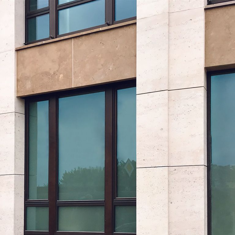 Application image for Limestone - Portuguese Coralau. The image shows this material being used for full bed veneer and window well.