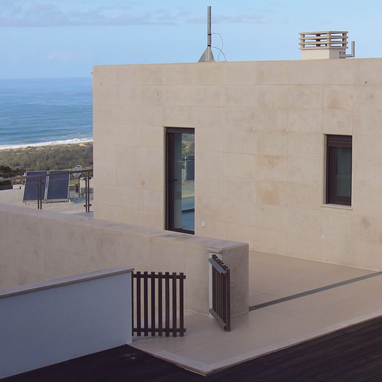 Application image for Limestone - Portuguese Pacific Beige. The image shows this material being used in a full bed veneer application.