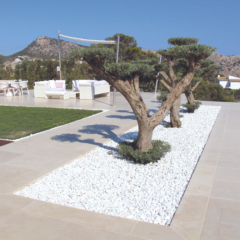 Application image for Limestone - Portuguese Classic White. The image shows this material being used in a patio pavers application.