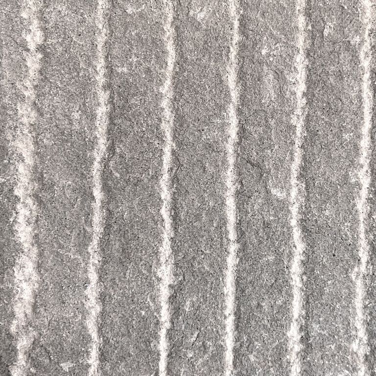 Color/Finish variation image for Italian Bluestone. The surface finish shown is grooved. The dominant color shown is gray; with a green secondary. The color mix creates a cool feeling. Regular and linear color patterns.