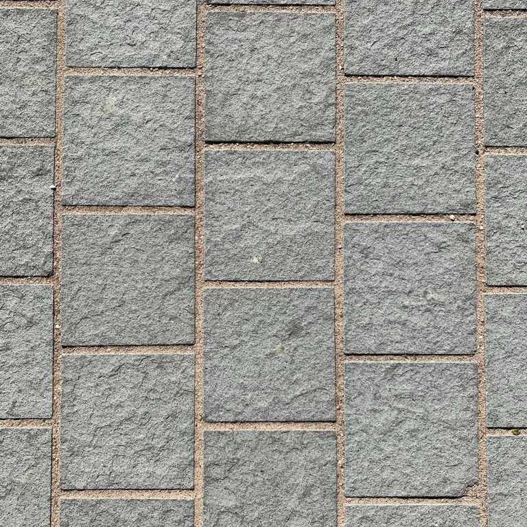 The image shows this material being used for driveway pavers, path pavers and patio pavers.