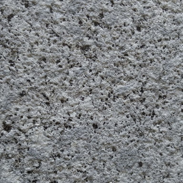 Color/Finish variation image for Colonial Blue Granite. The surface finish shown is sand blasted. The dominant color shown is gray. The color mix creates a cool feeling. Regular color pattern.