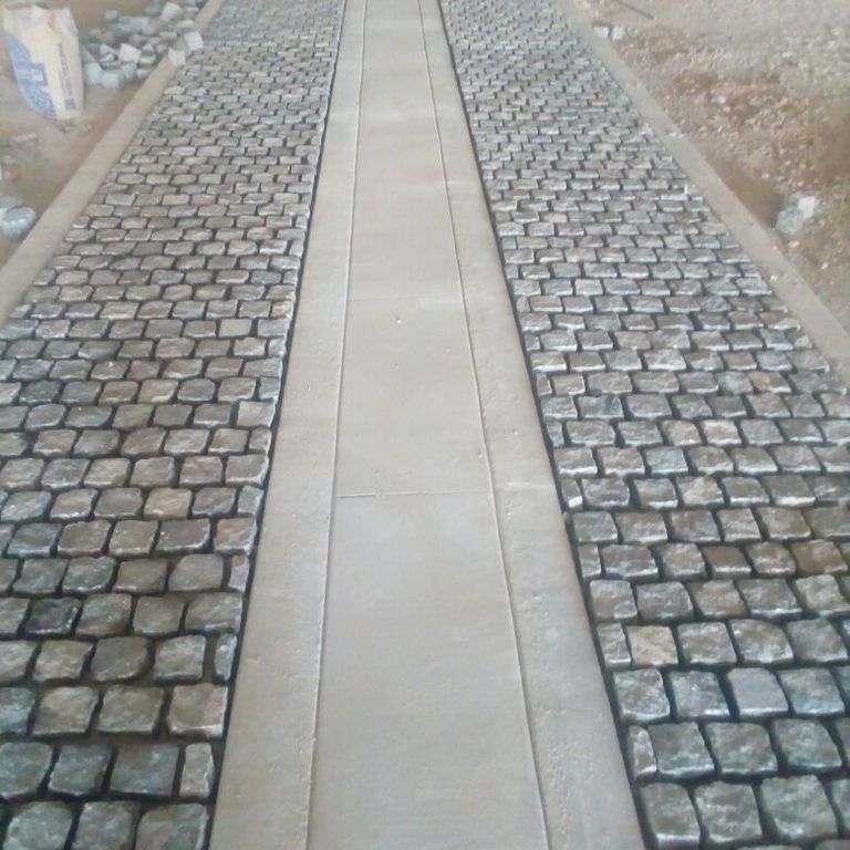 The image shows this material being used in a path pavers application.