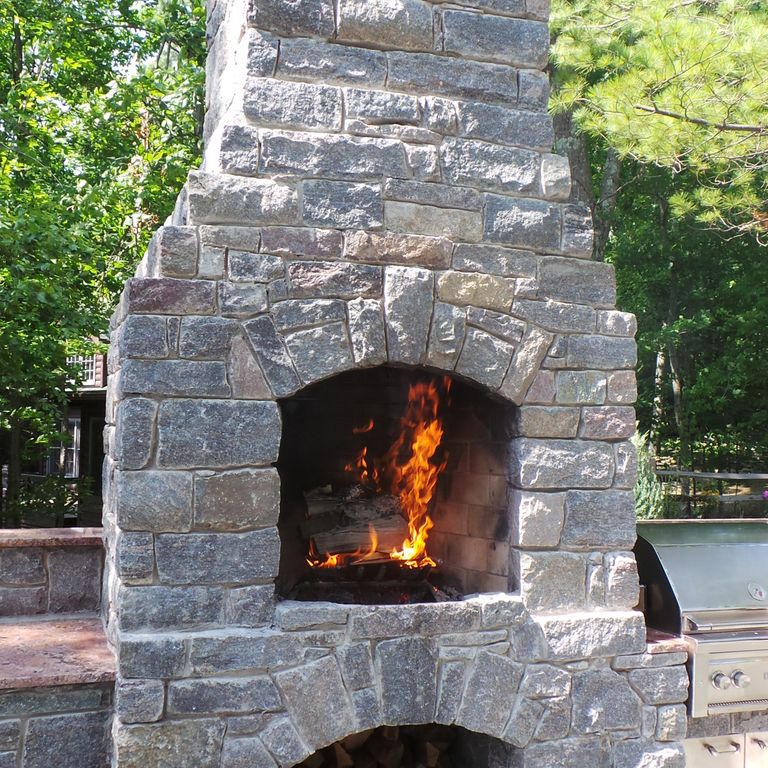 The image shows this material being used for fireplace surround and thin veneer.