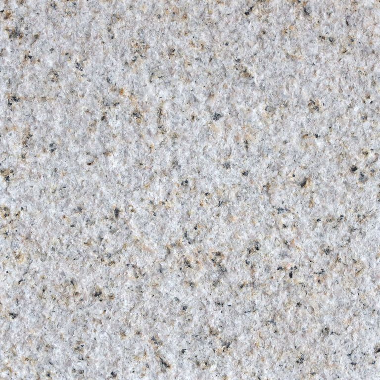 Color/Finish variation image for Granite - Golden. The surface finish shown is bush hammered. The dominant color shown is gray; with beige, blue, pink, purple and cream secondaries. The color mix creates a cool feeling. Fine speckled color pattern.