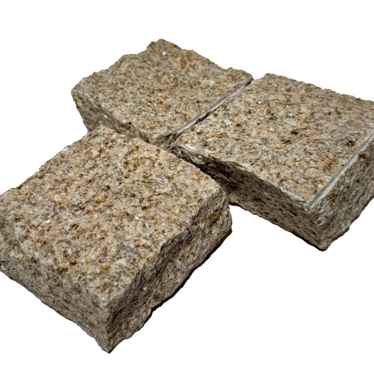 Application image for Granite - Golden. The image shows this material being used for driveway pavers, path pavers, patio pavers and driveway aprons. The surface finish shown is split-face. Dominant colors shown are brown and tan. The color mix creates a warm feeling.