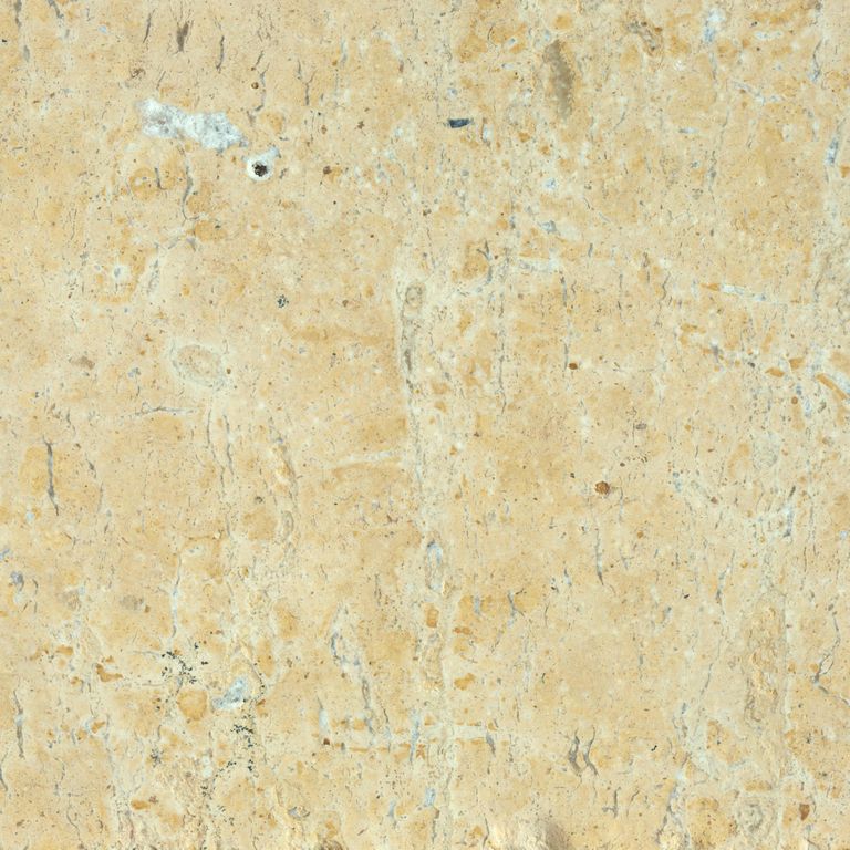 Best close-up image for Limestone - China Buff. The surface finish shown is antiqued. Dominant colors shown are beige, orange/rust, yellow and tan; with brown, orange/rust and cream secondaries. Exhibits 