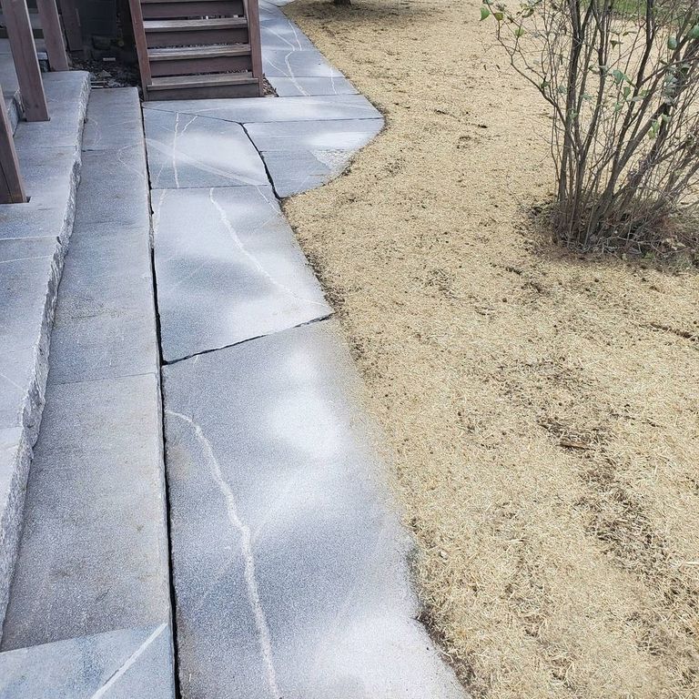 The image shows this material being used for path pavers and monolithic steps.