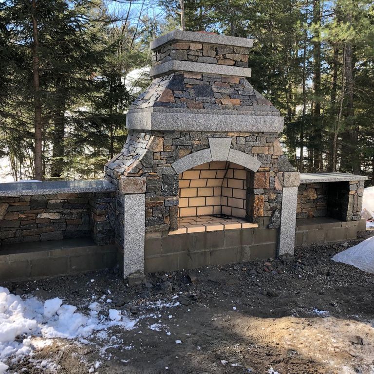 Application image for Granite - Connecticut Blend Thin Veneer. The image shows this material being used for fireplace surround, landscape wallstone and thin veneer.