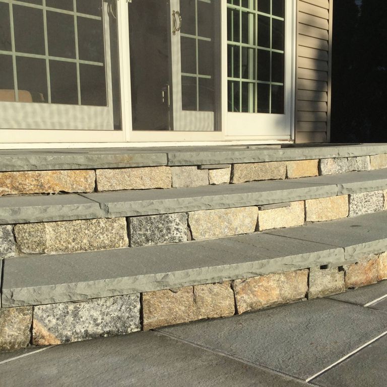 Application image for Connecticut Blend Granite. The image shows this material being used in a treads application. This is a building and landscape stone for indoor and outdoor commercial and residential applications. Suitable for general use, freeze-thaw conditions, low heat absorption surfaces and low slipperiness surfaces situations. Relatively moderate in price.
