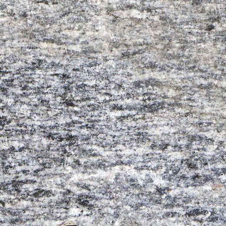 The surface finish shown is . The dominant color shown is gray. The color mix creates a cool feeling. Coarse speckled and streaked color patterns.