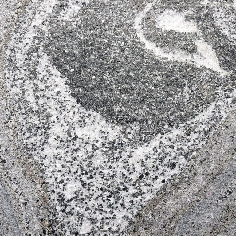 Color/Finish variation image for American Mist Granite. The surface finish shown is flamed. The dominant color shown is gray; with beige, black, blue, brown, green, pink, purple, white and cream secondaries. Exhibits 