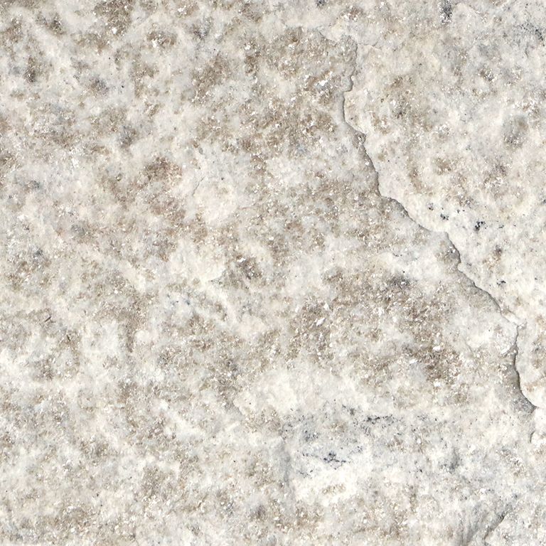 The surface finish shown is split-face. Dominant colors shown are beige, gray, white and cream. The color mix creates a cool feeling. Random, speckled, coarse speckled and blotched color patterns.