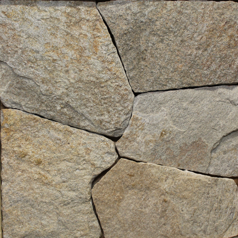 Close-up image for Colonial Tan Granite. The surface finish shown is natural. Dominant colors shown are brown and tan; with gray and orange/rust secondaries. Exhibits 