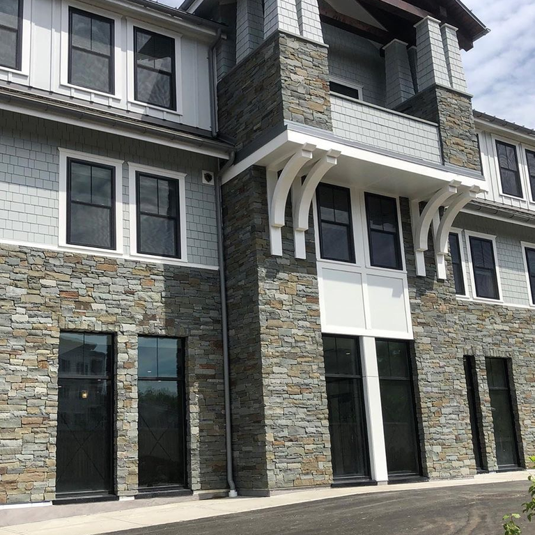 Application image for Granite - Colonial Tan. The image shows this material being used for full bed veneer and thin veneer.