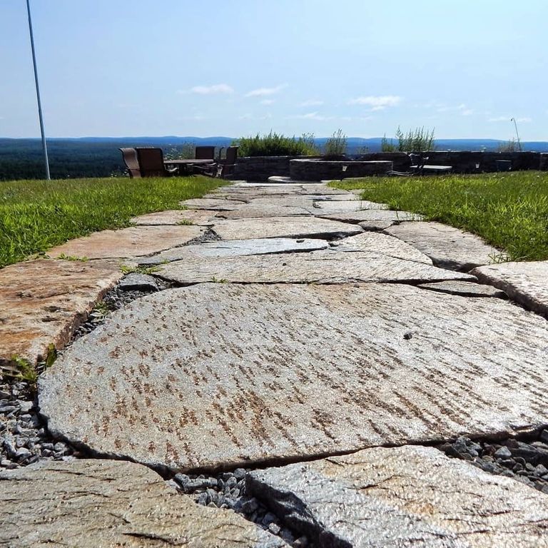 Application image for Granite - Colonial Tan. The image shows this material being used in a path pavers application.